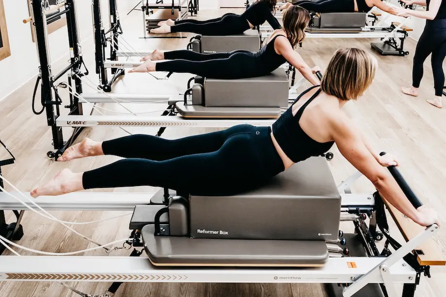 A student performing pilates during a Mixed Method class